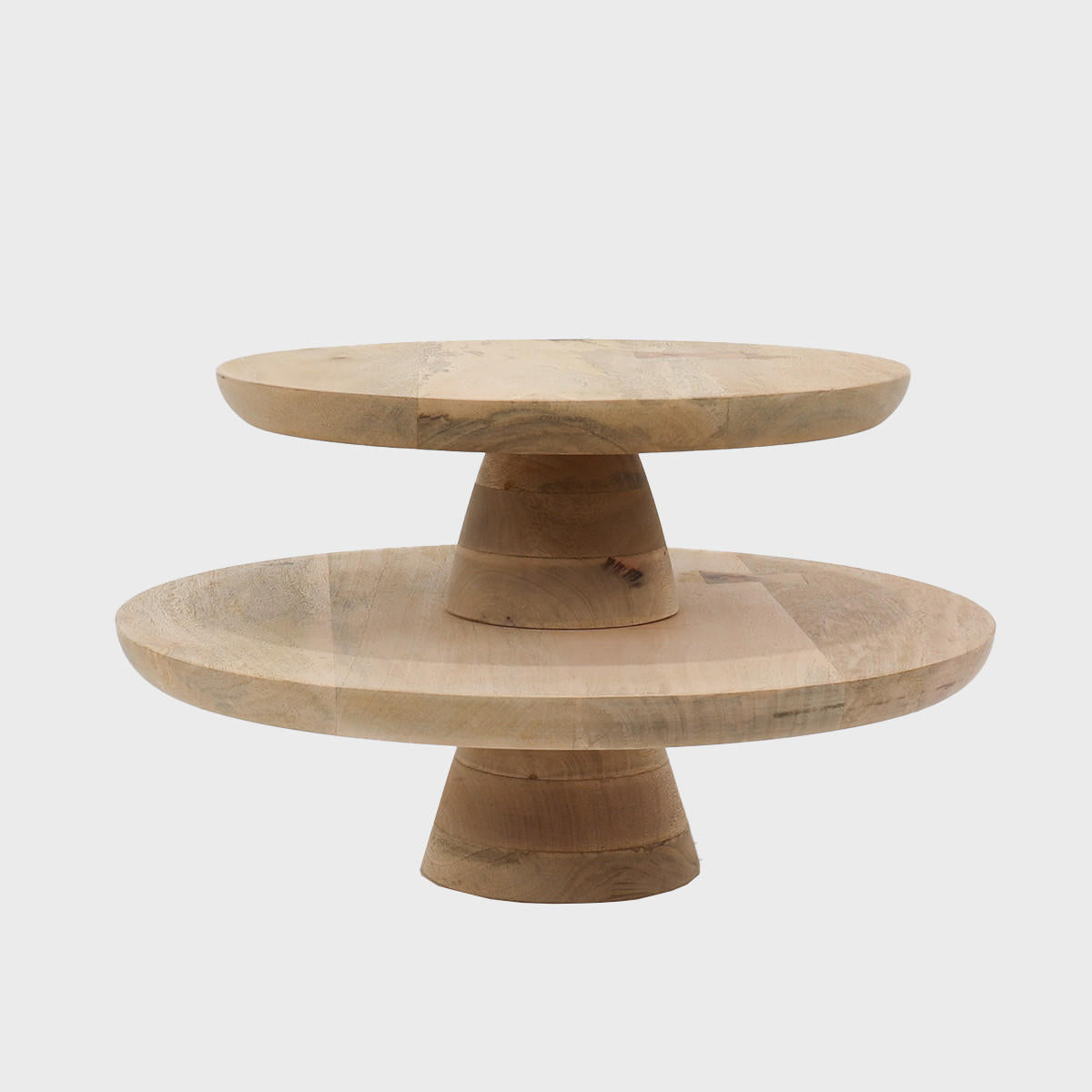 Mango wood wooden cake stand featuring a stable base and decorative scalloped edge.