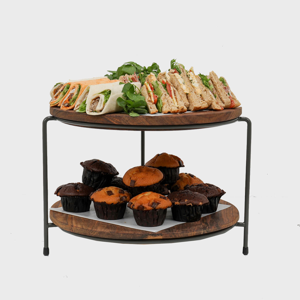Leander metal tiered riser with sheesham wood serving board designed to add functional height and dimension.
