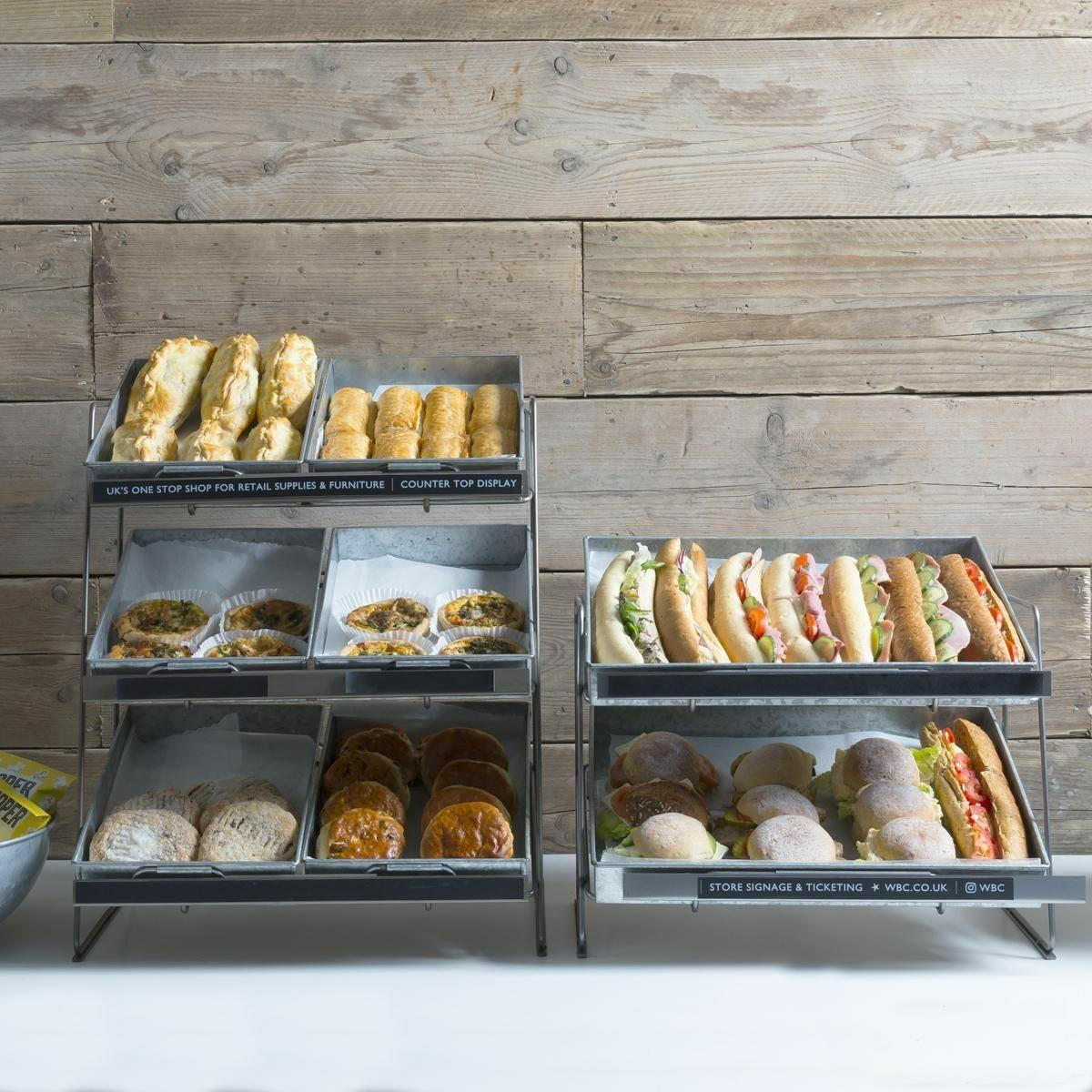 Railton tiered steel counter top display unit featuring a multi-tiered layout for product positioning.
