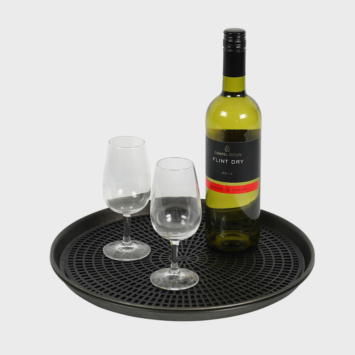 Round bar tray with non-slip mat with structured, low-profile walls and open-top design.