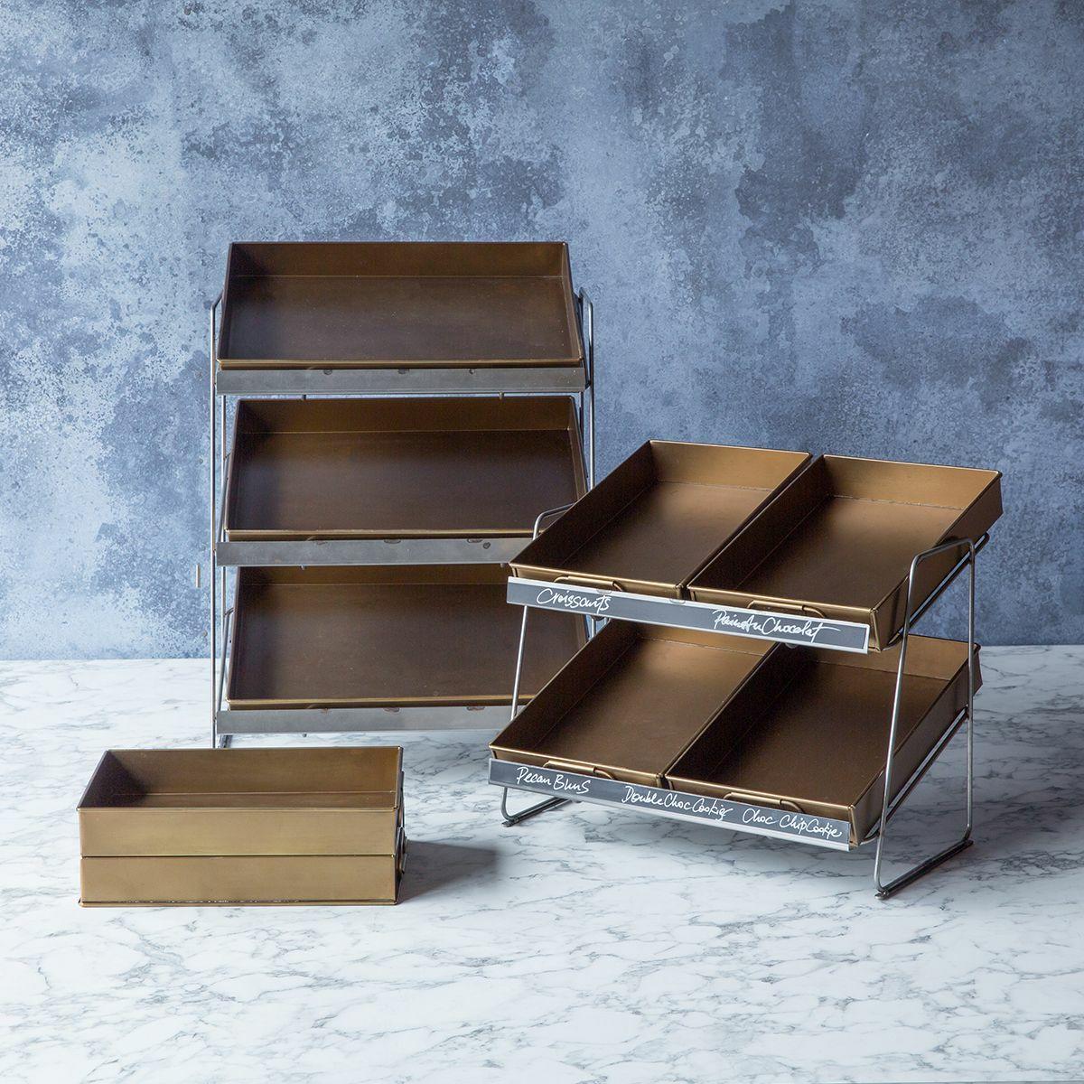 Railton countertop display unit with medium brass metal trays featuring a multi-tiered layout for product positioning.
