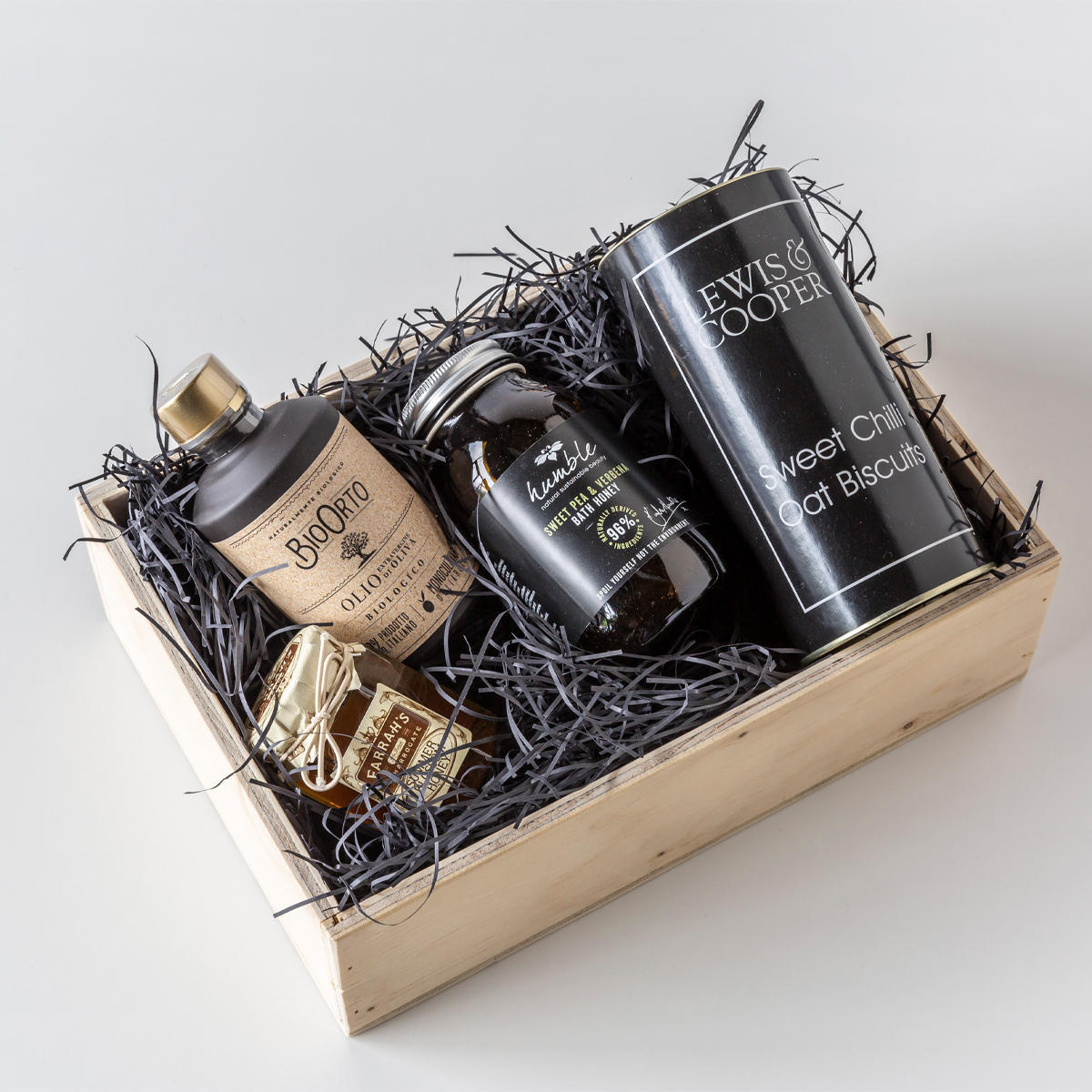 Wooden hamper box with drop on lid from high-density rigid paperboard.