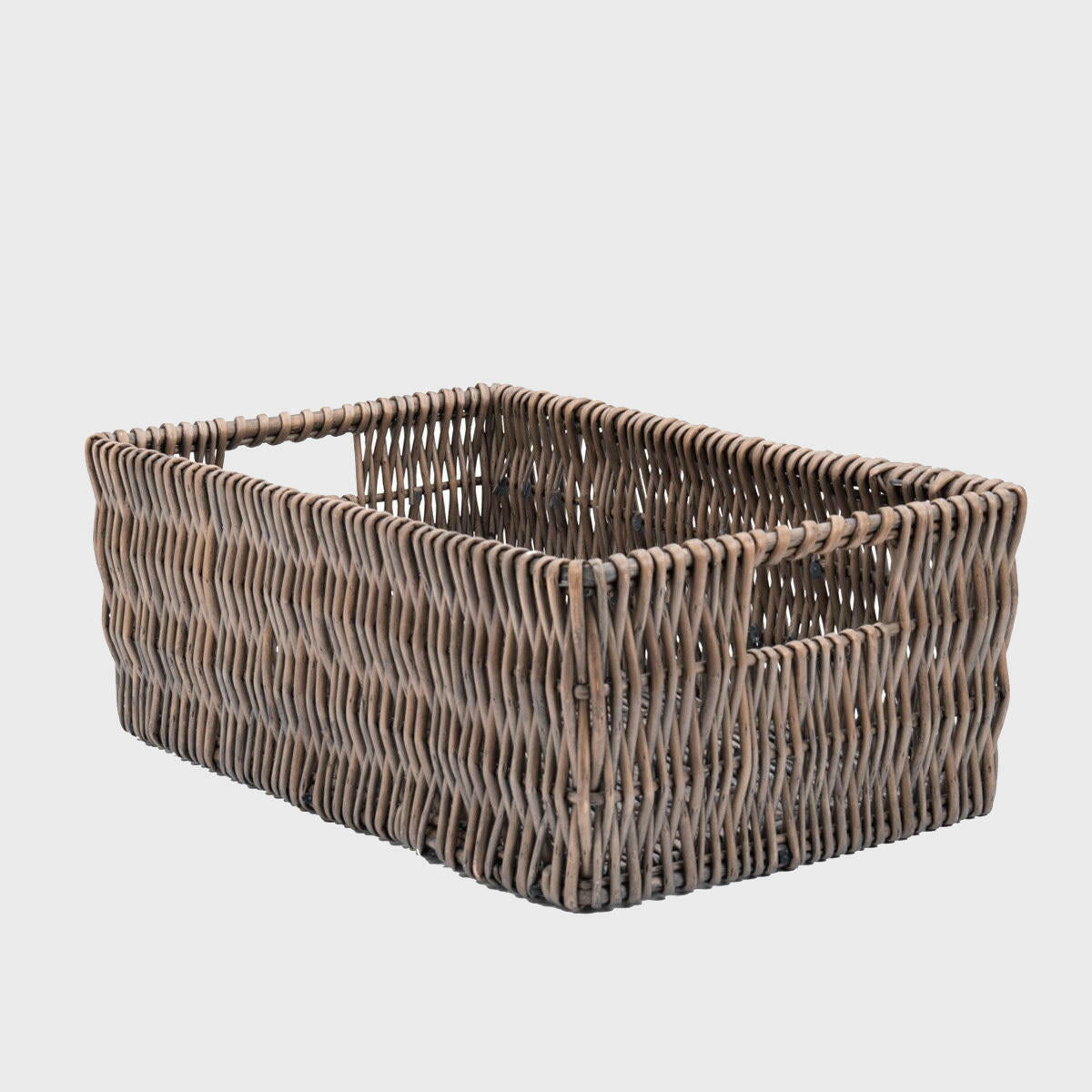 Medium deep wicker tray with handles with structured, low-profile walls and open-top design.