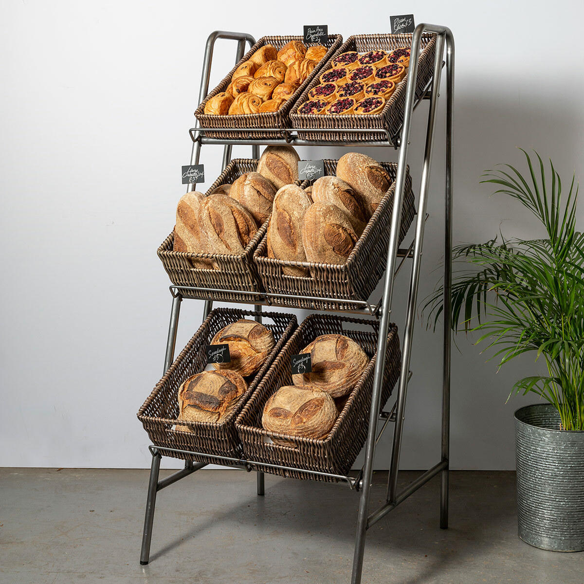 Camberwell retail stand 3 shelf with chatto wicker trays in pewter brown multi-tiered layout for product positioning.