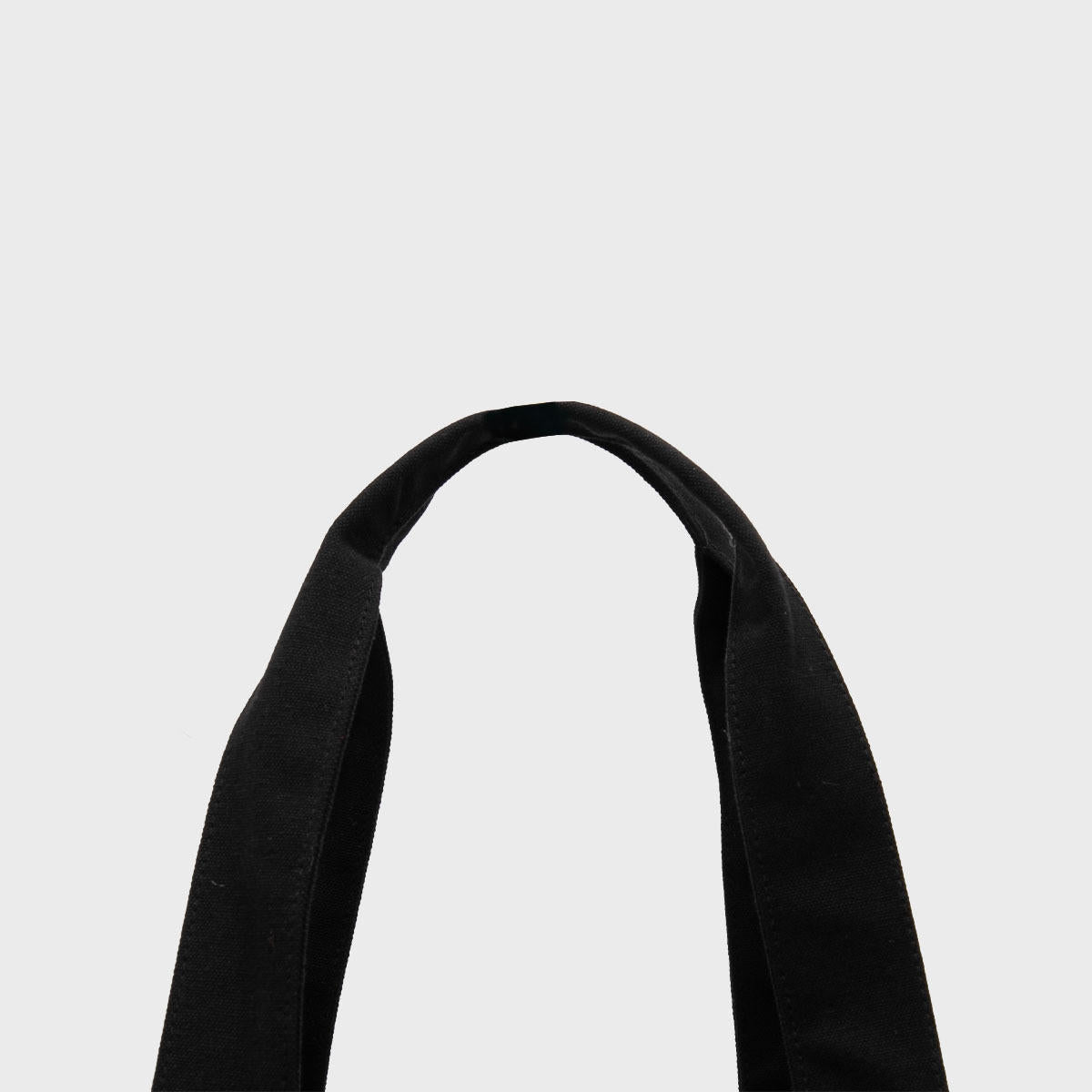 Large black 12oz recycled canvas bag with side pocket.