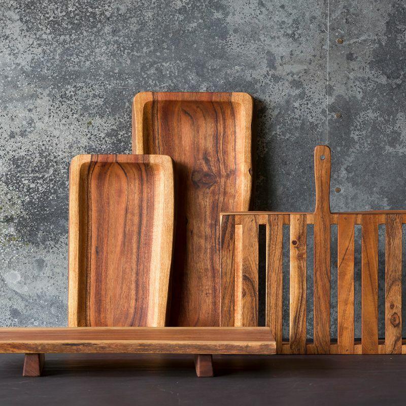 Scooped wooden serving board crafted from durable hardwood with natural grain detail.