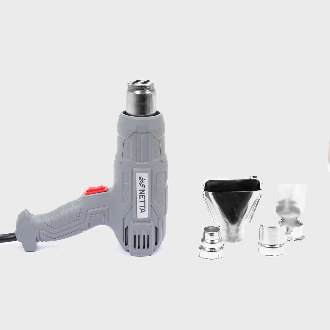 Hot air shrink wrap gun with blade nozzle.