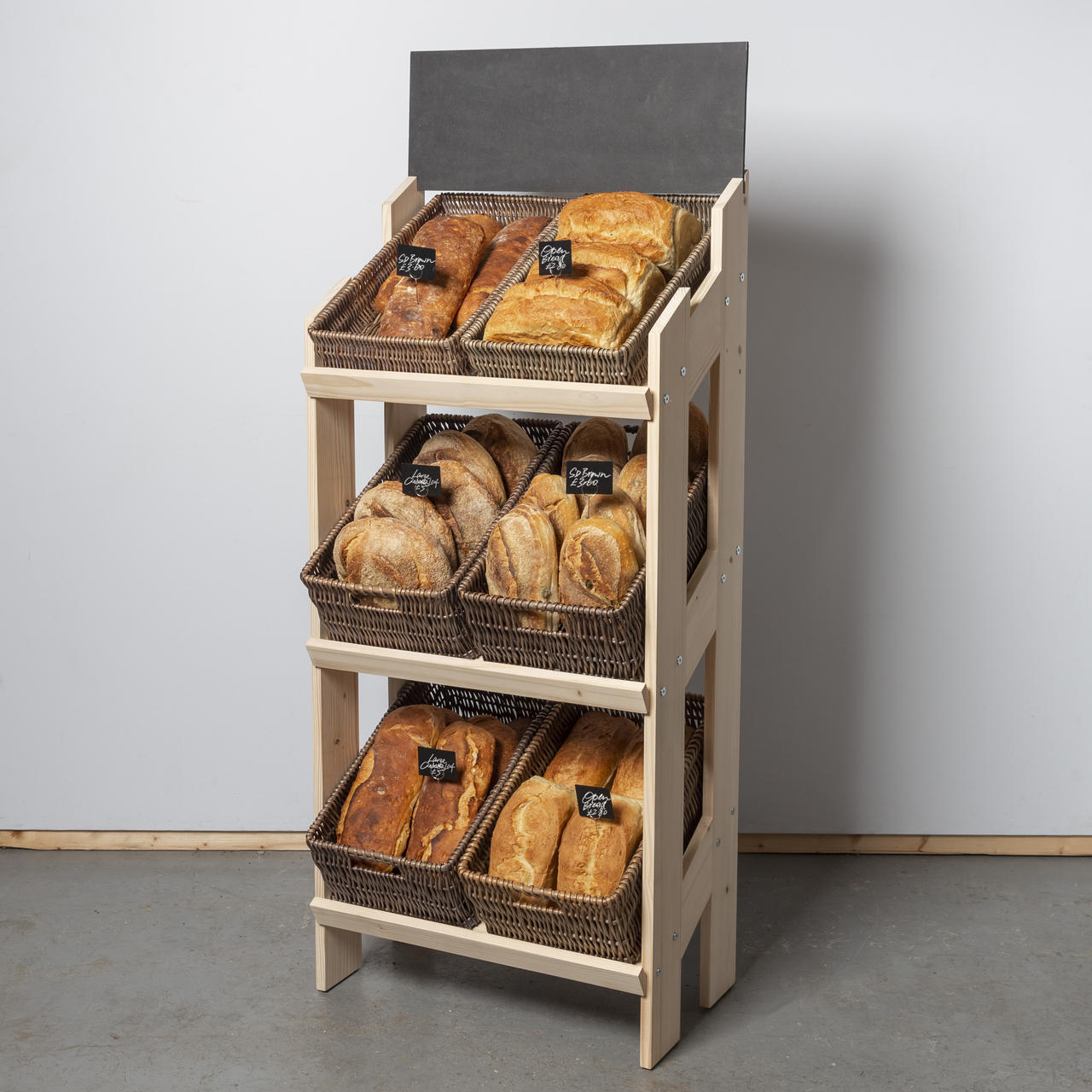 Norwood 3-shelf stand with dark wicker trays 650 featuring a multi-tiered layout for product positioning.