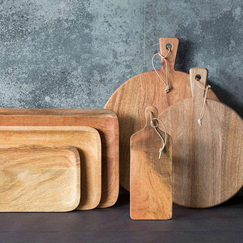 Small scooped wooden serving board crafted from durable hardwood with natural grain detail.