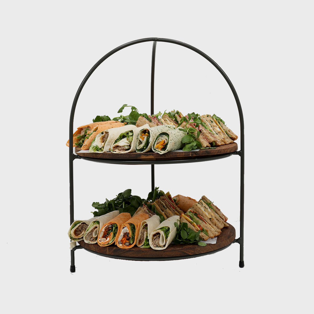 Leander metal tiered riser with sheesham wood serving board designed to add functional height and dimension.