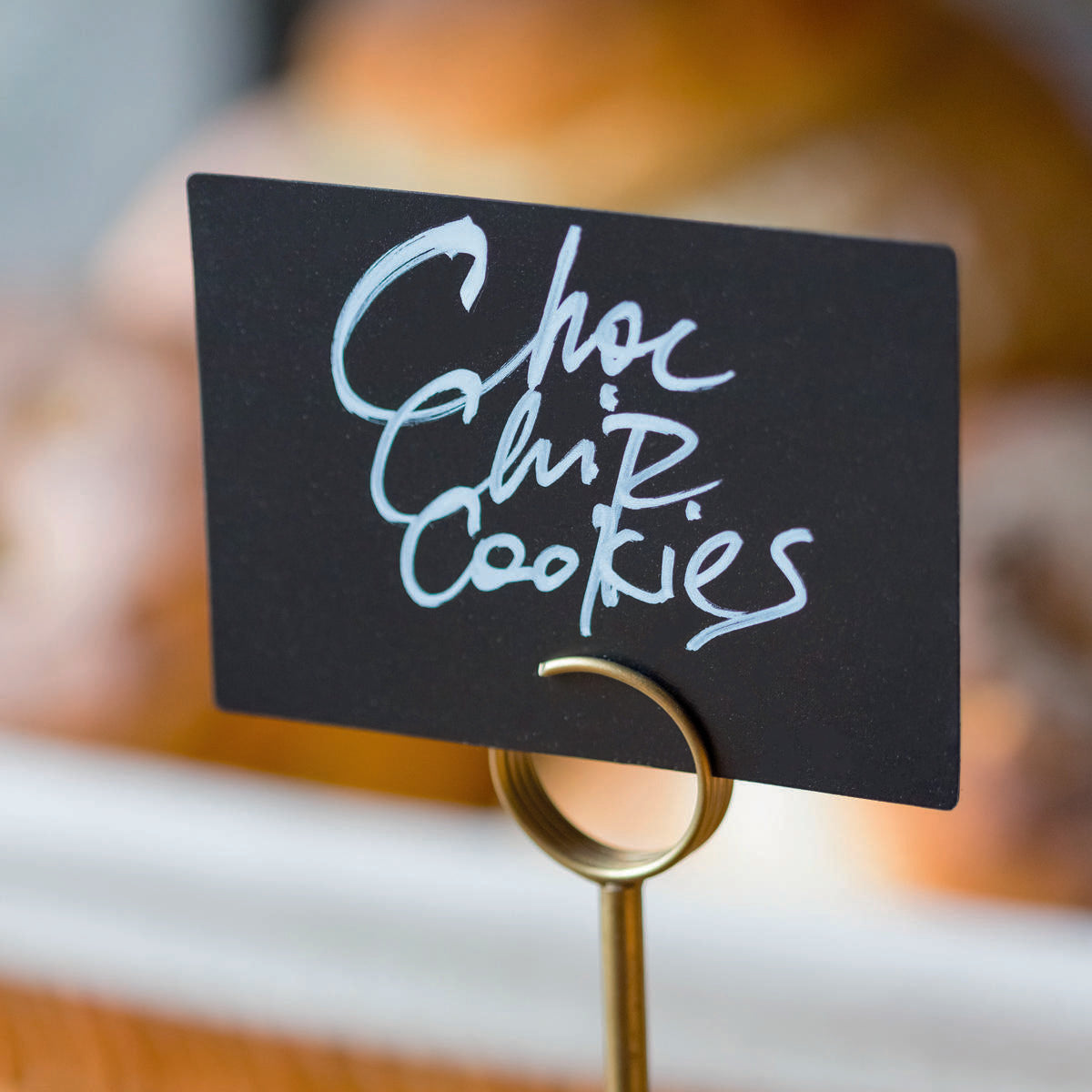 Derwent small adjustable signage stand with a clean surface for visible retail messaging.