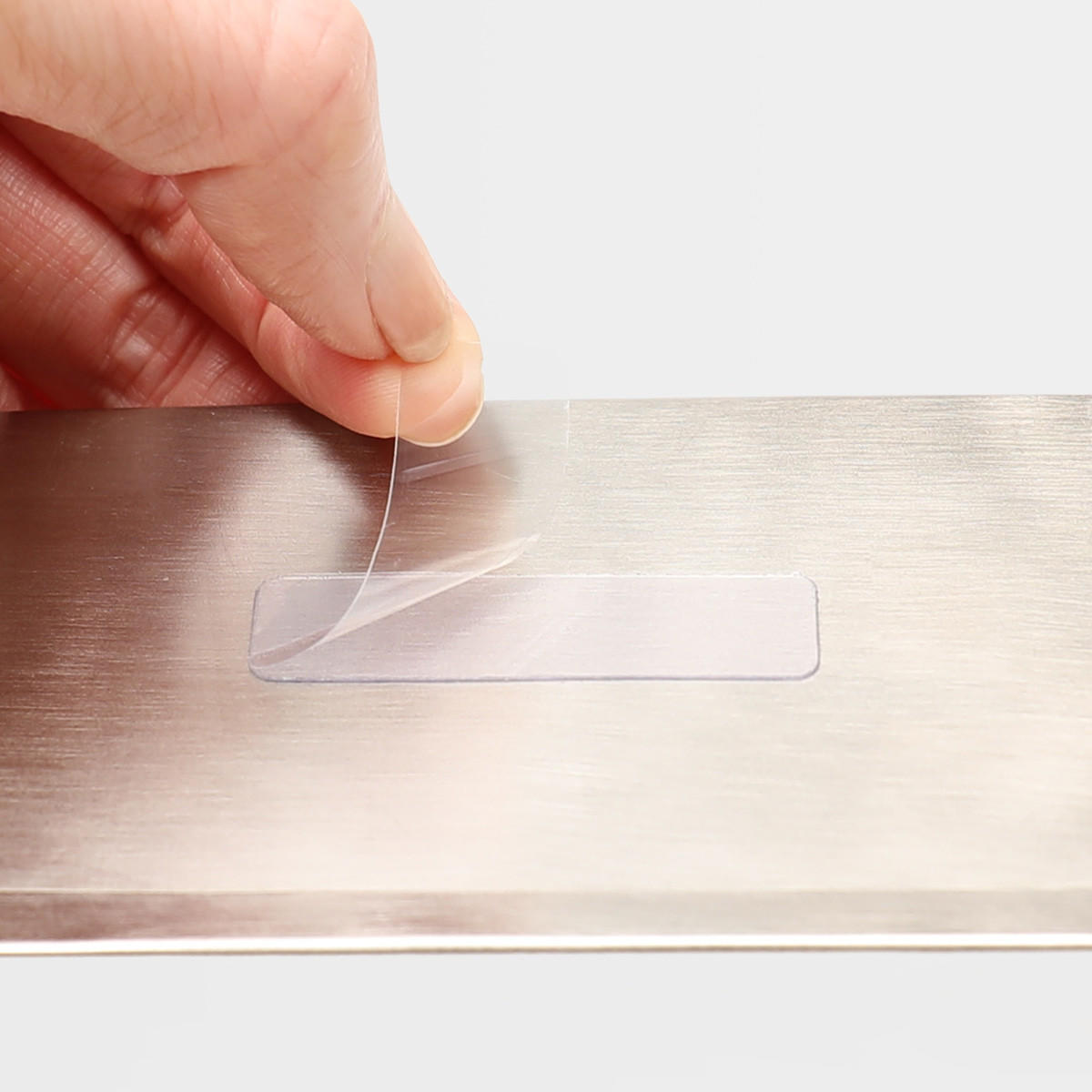 Self adhesive silver card holder.