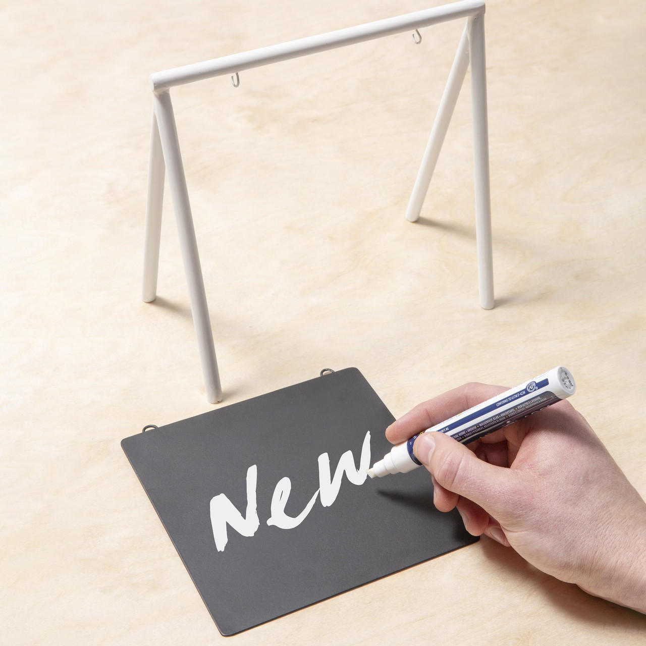 Square black and white table sign.