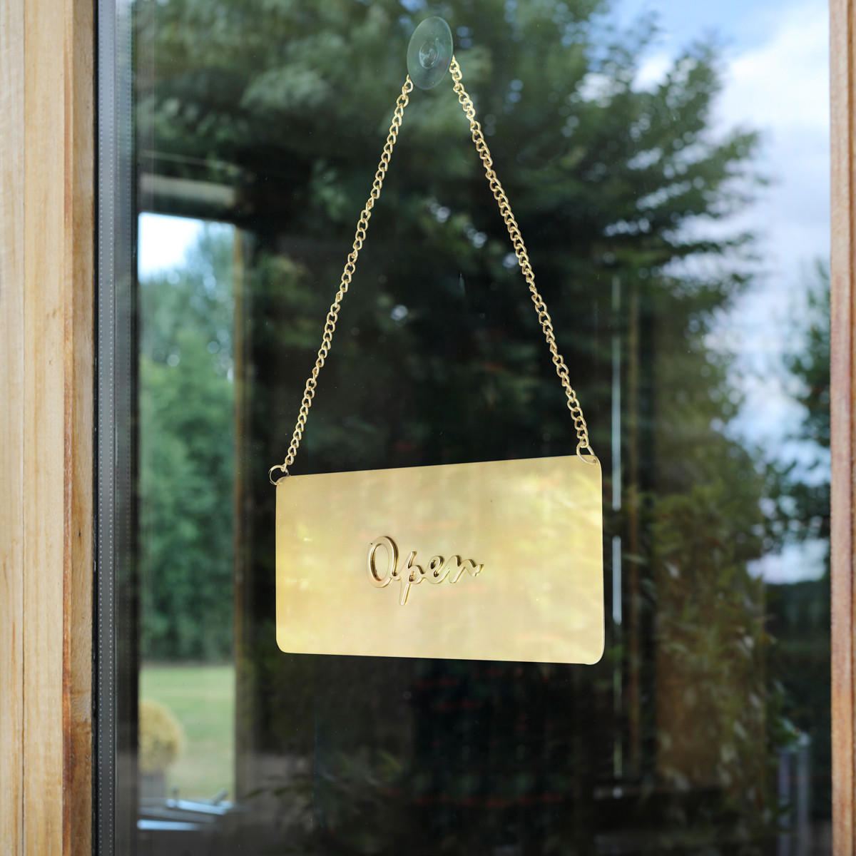 Matt brass open and closed hanging sign.