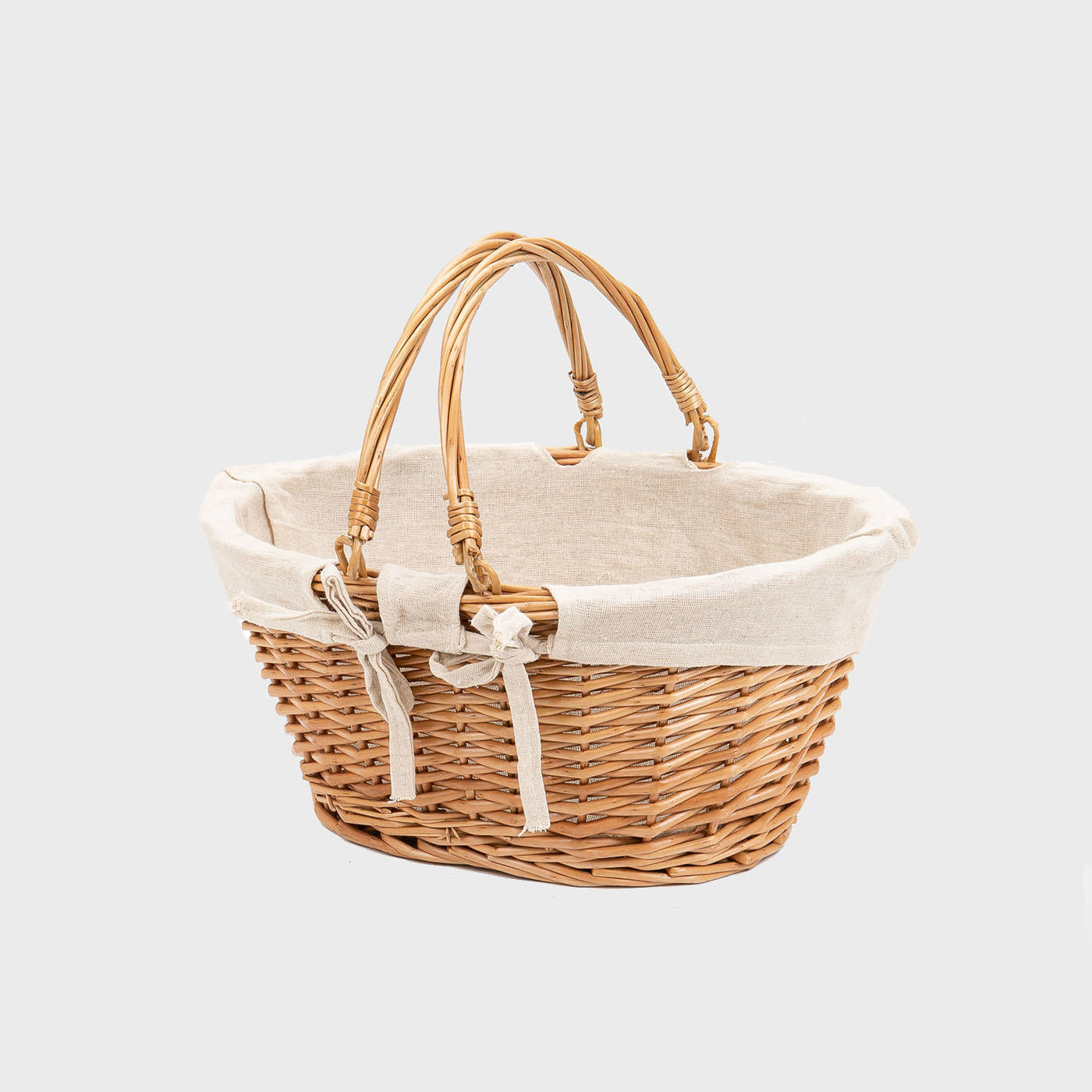 Medium oval natural wicker basket hand-woven from natural split-wicker.