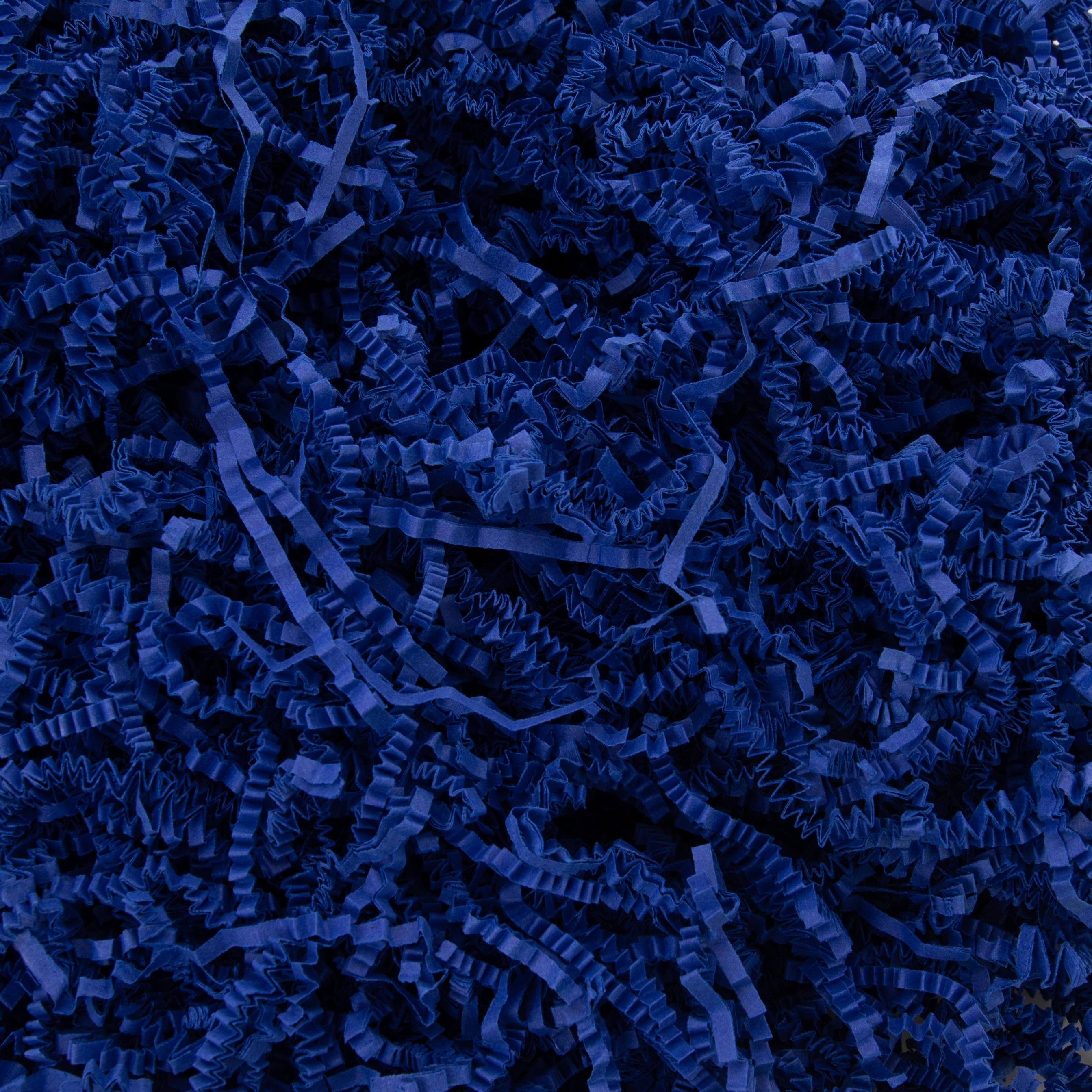 Sizzlepak shredded paper 10kg consisting of interlocking zig-zag paper shreds for fill.