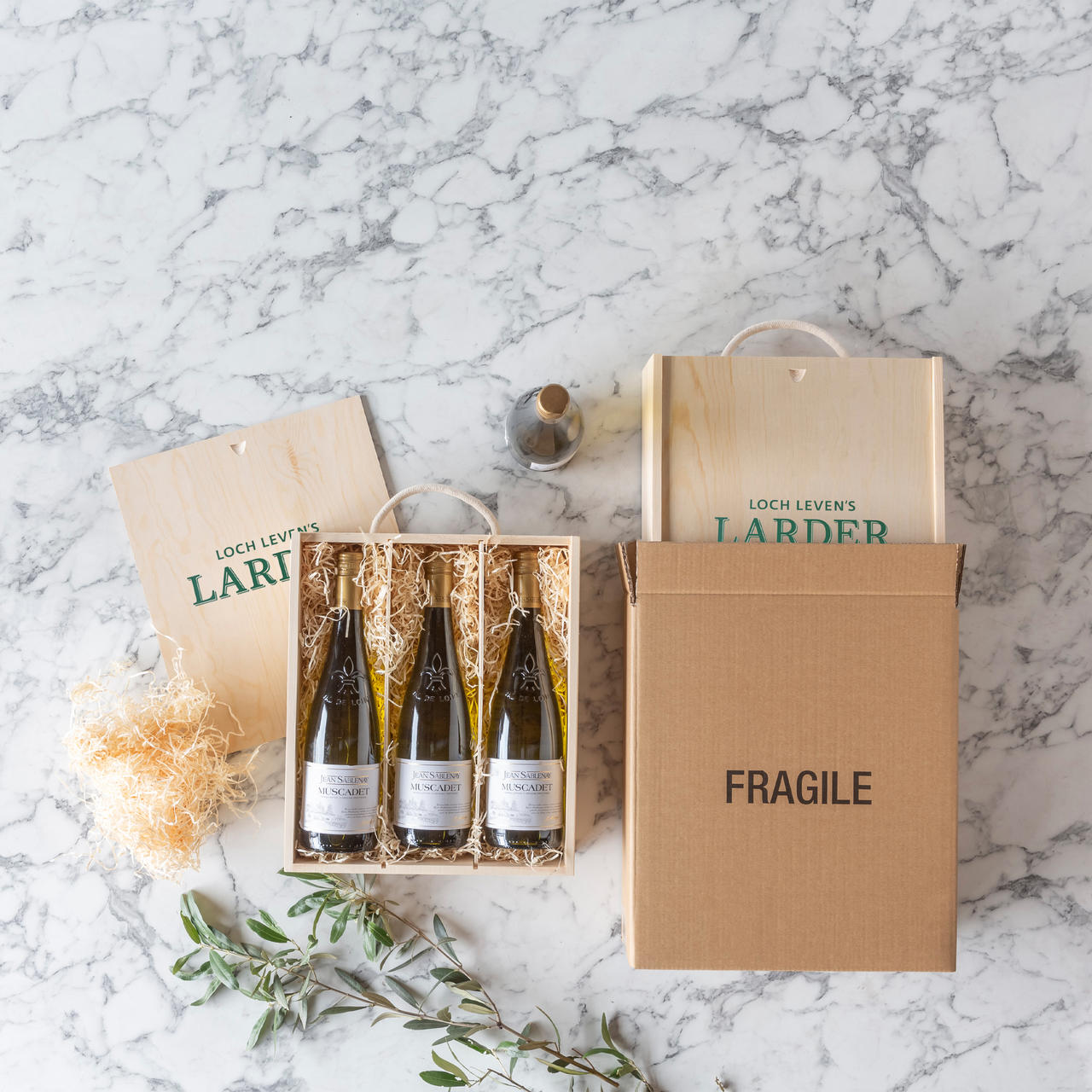 3 Bottle wooden box with rope handle with premium natural wood grain and secure hardware closures.