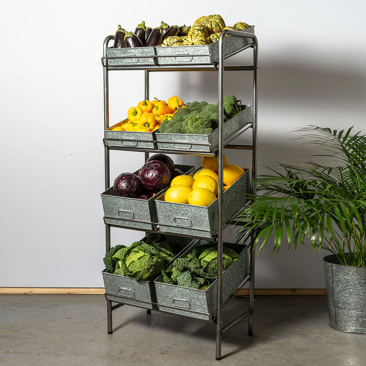 Camberwell retail stand 4 shelf with chatto chatto metal tray featuring a multi-tiered layout for product positioning.