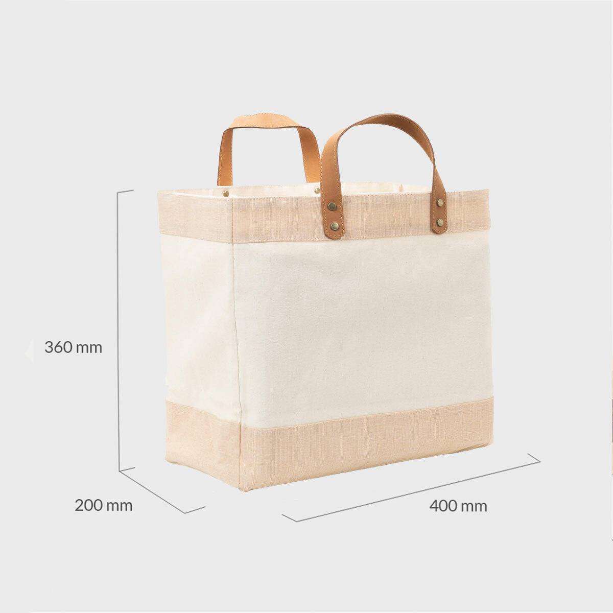 Large natural canvas market bag with leather handles.