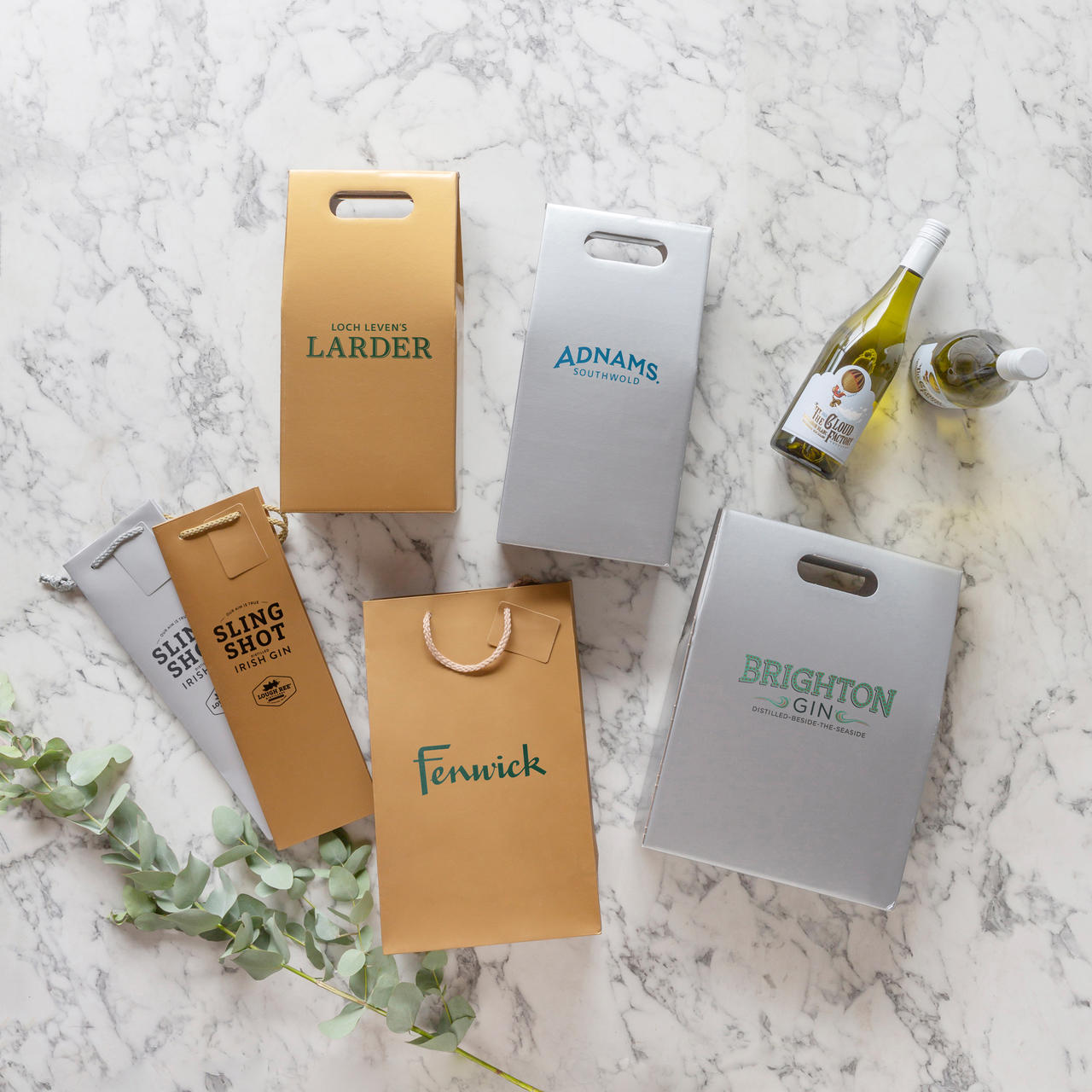 1 Bottle laminated gift bag featuring a patterned finish and heavy-duty handles.