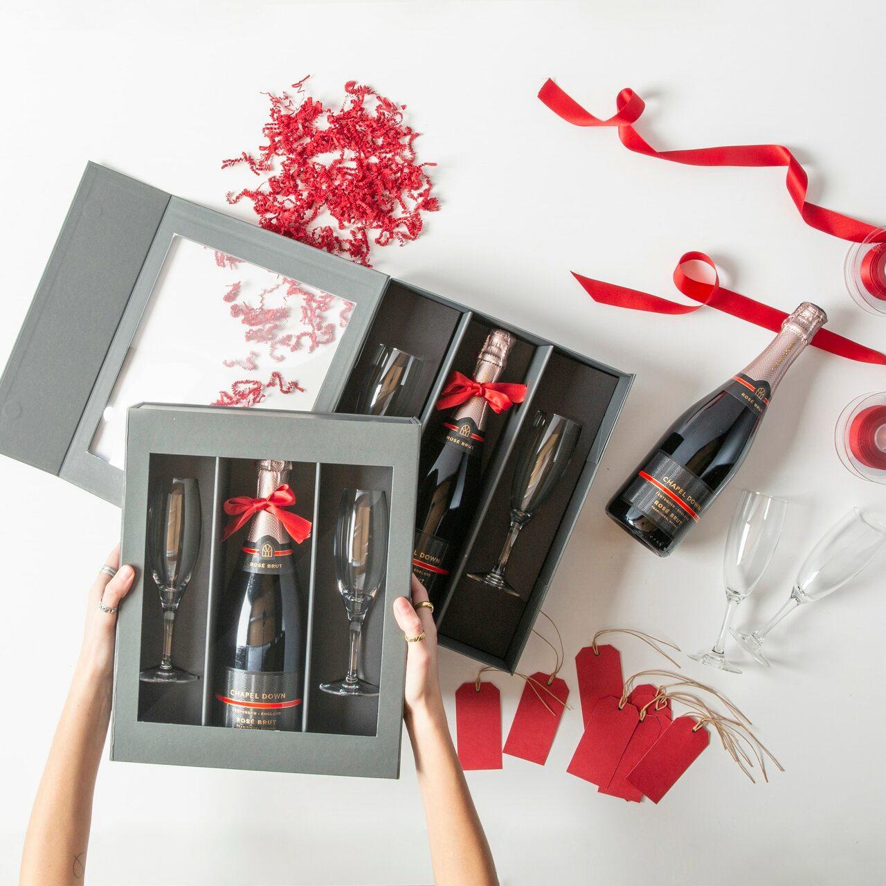 Magnetic bottle gift box with champagne flutes from high-density rigid paperboard.