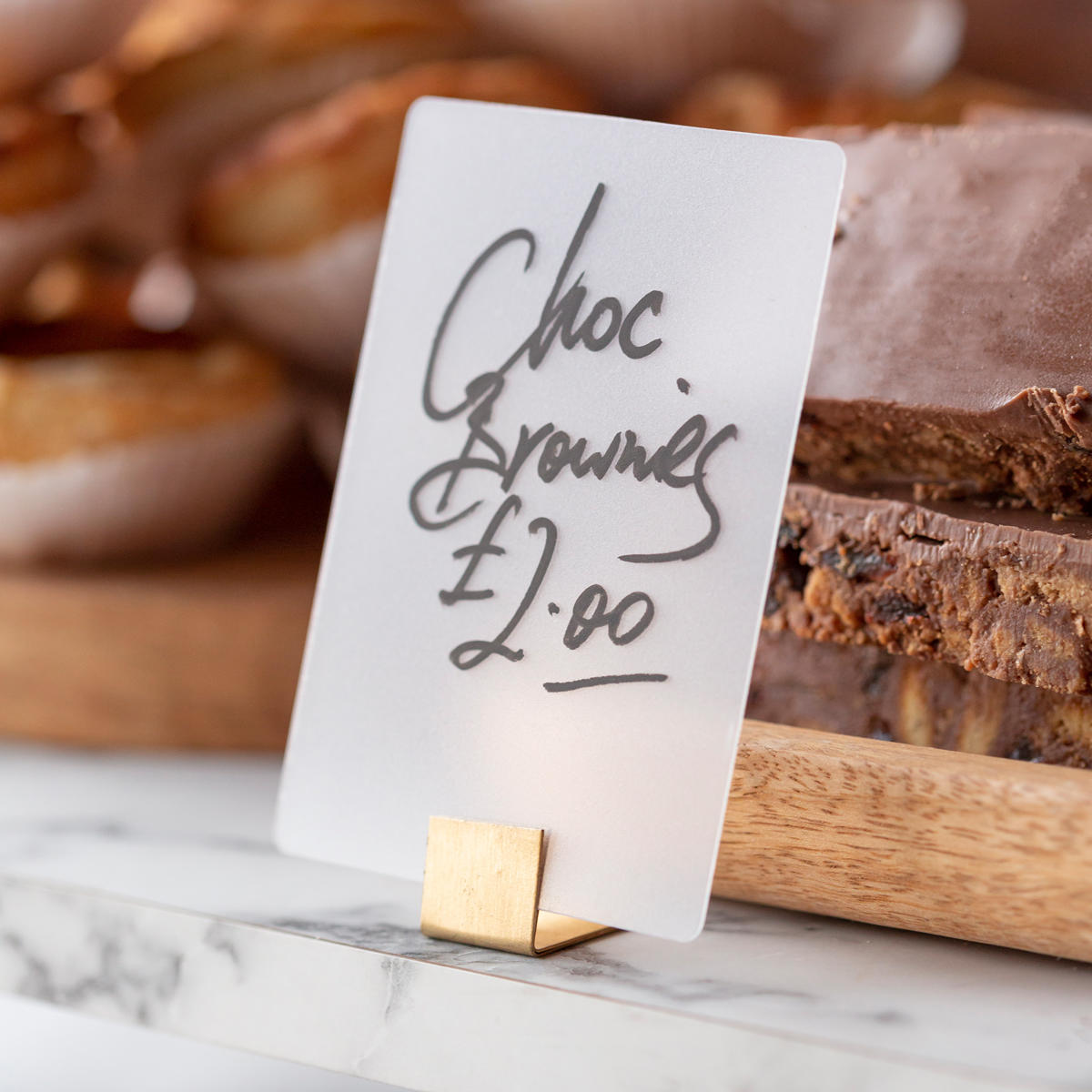Reversible frosted signage tags with a clean surface for visible retail messaging.