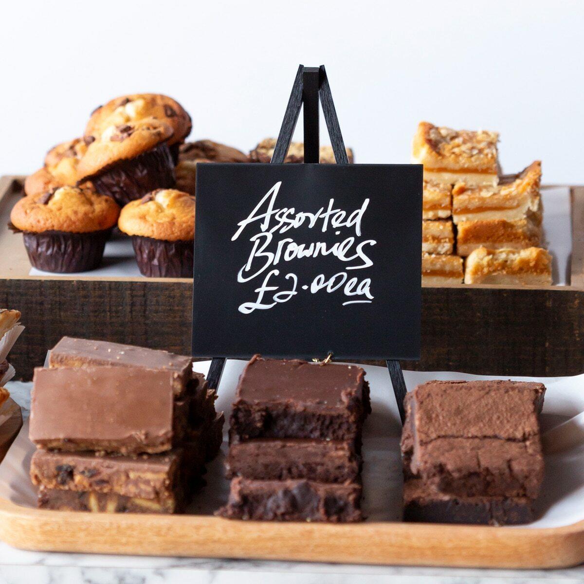 Mini-tripod chalkboard with a clean surface for visible retail messaging.